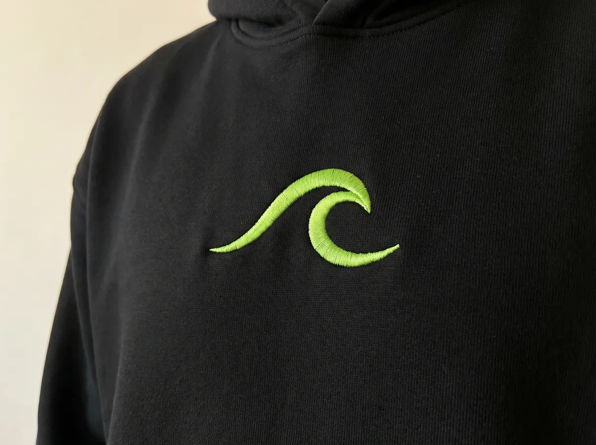 An embroidered logo on the chest