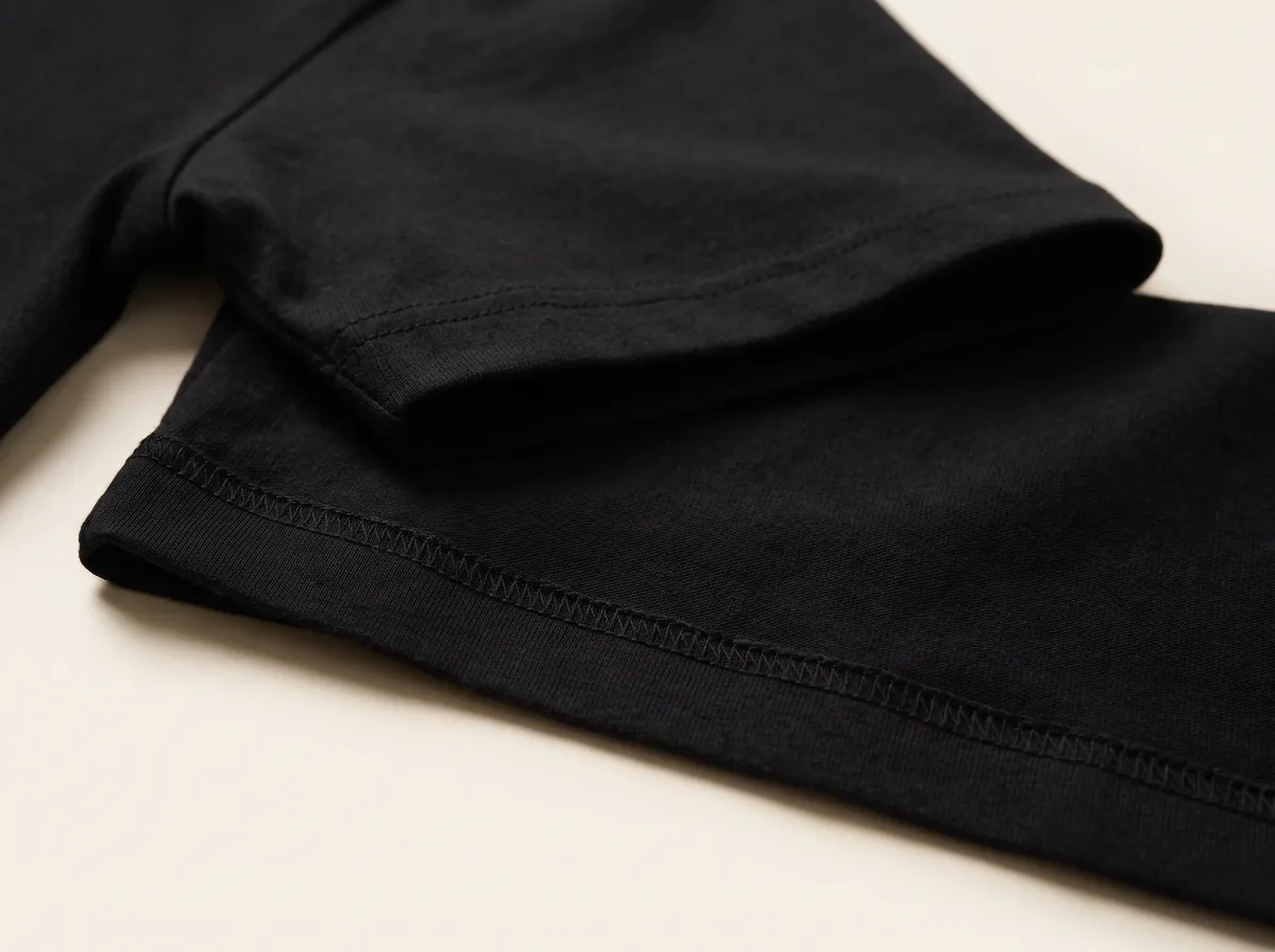 Close-up of the double needle stitched sleeve and hem