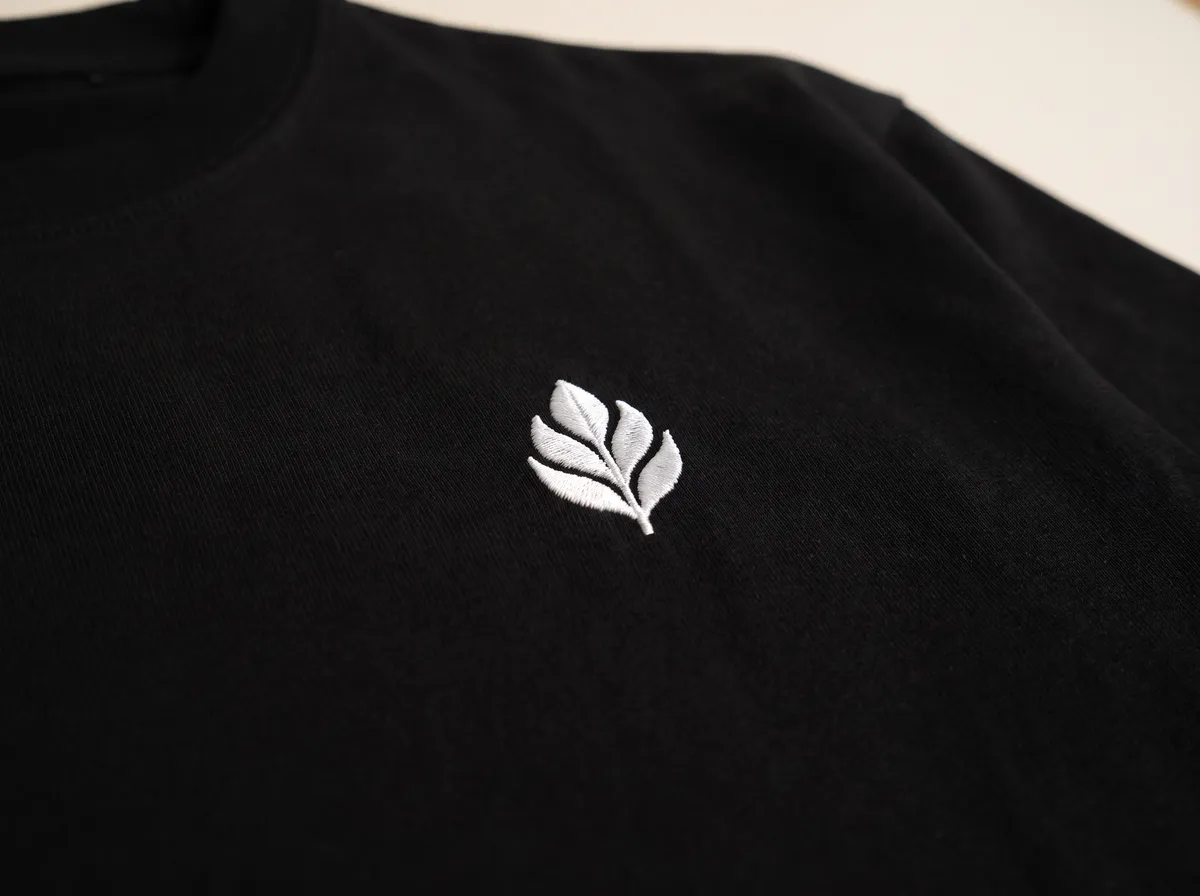 An embroidered logo on the chest