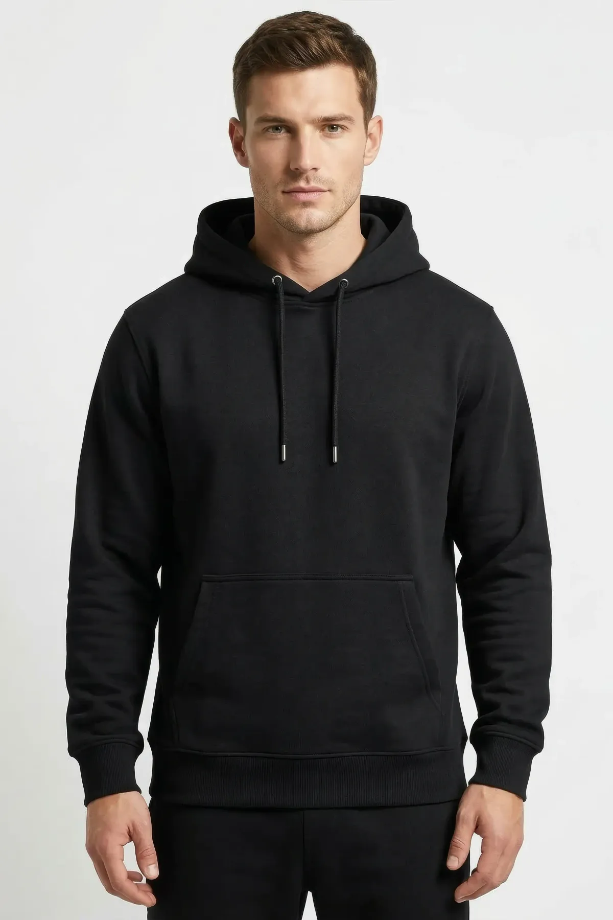 Classic Hoodie in Black, front, on a man