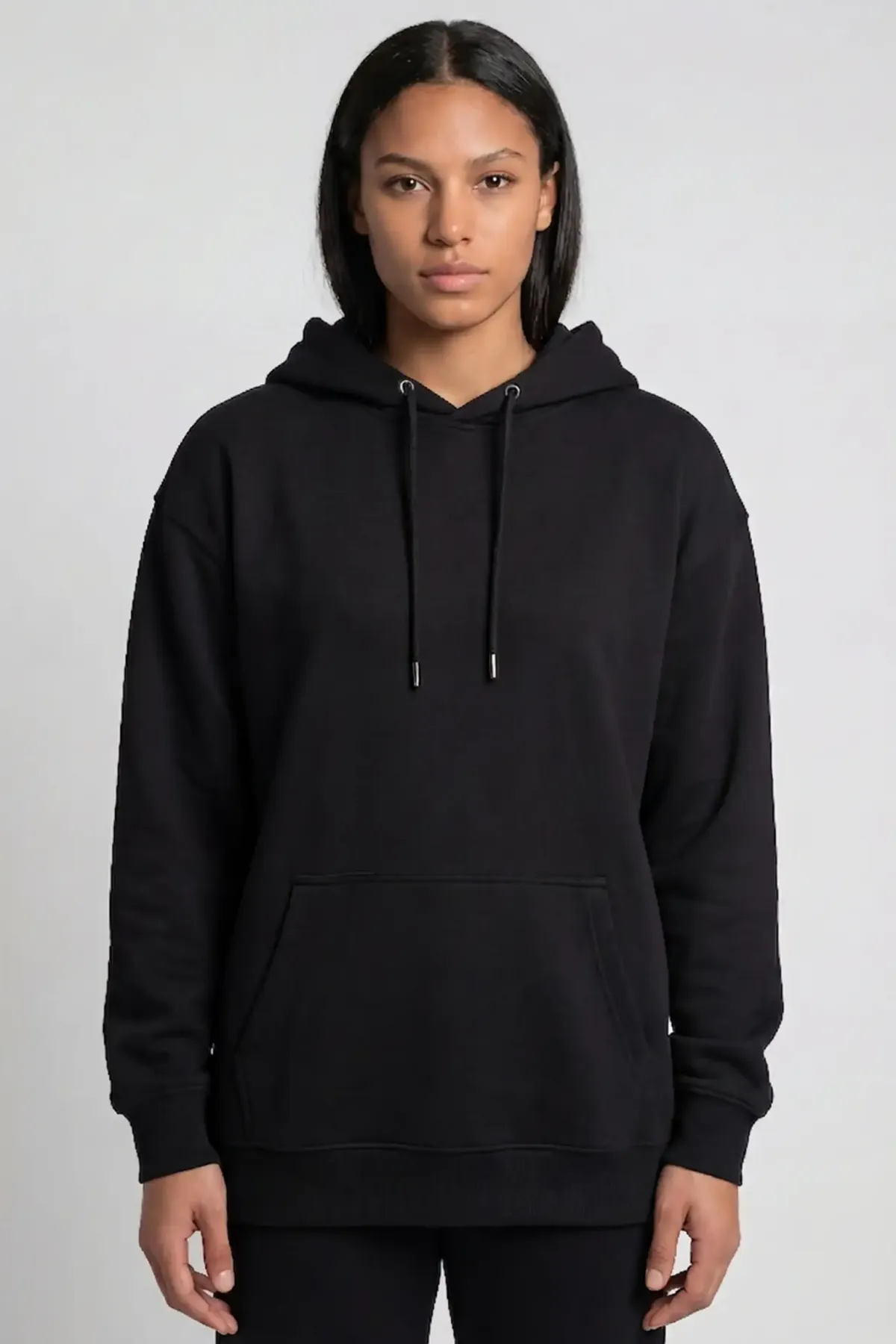 Classic Hoodie in Black, front, on a woman